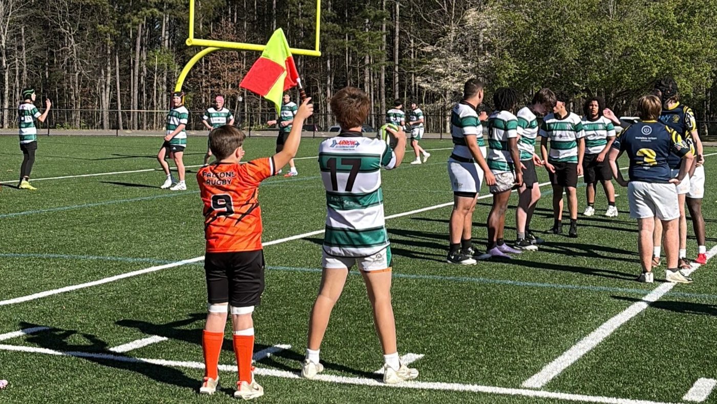 Match day: sponsor branding visible on jersey chest, sleeves, back and shorts